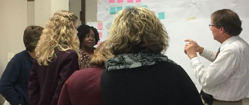 Organizational and Professional Development instructor conducting a group exercise with a group of university employees. 