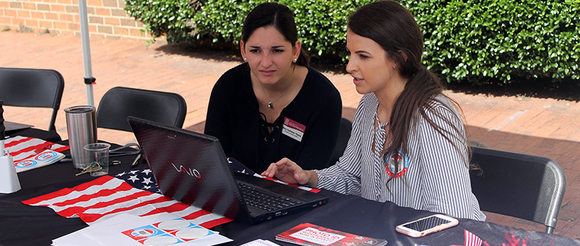 Students registering other students to vote.