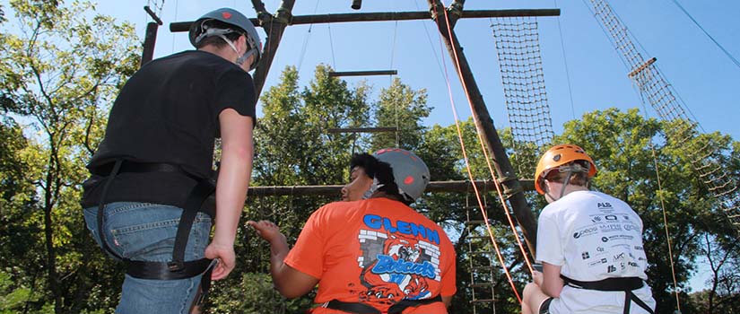 Group of students participating in a rope course during Camp Cocky Leadership Retreat