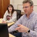 A librarian assists a patron at the Thomas Cooper Library.