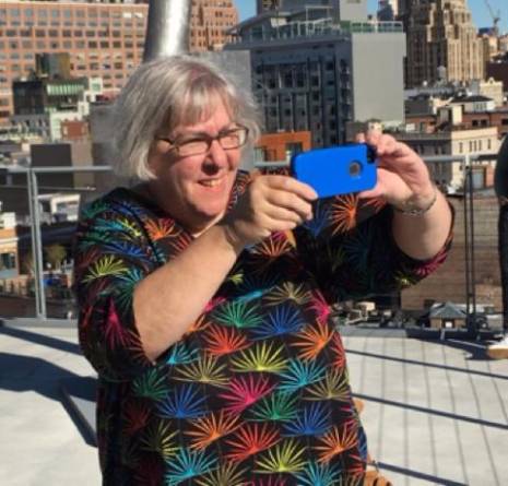 Ina Rae Hark with an iphone