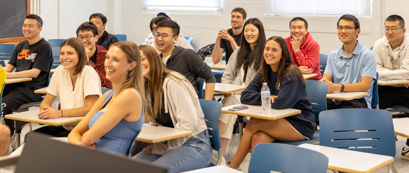 students laughing and enjoying a stats class