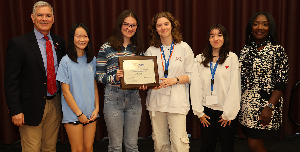 students holding certificates