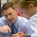 student and teacher working