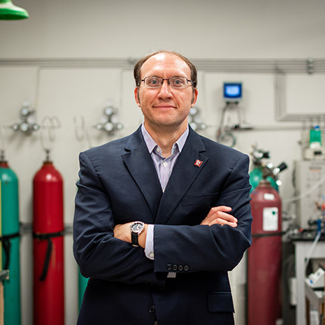 Dr. mustain standing in his lab