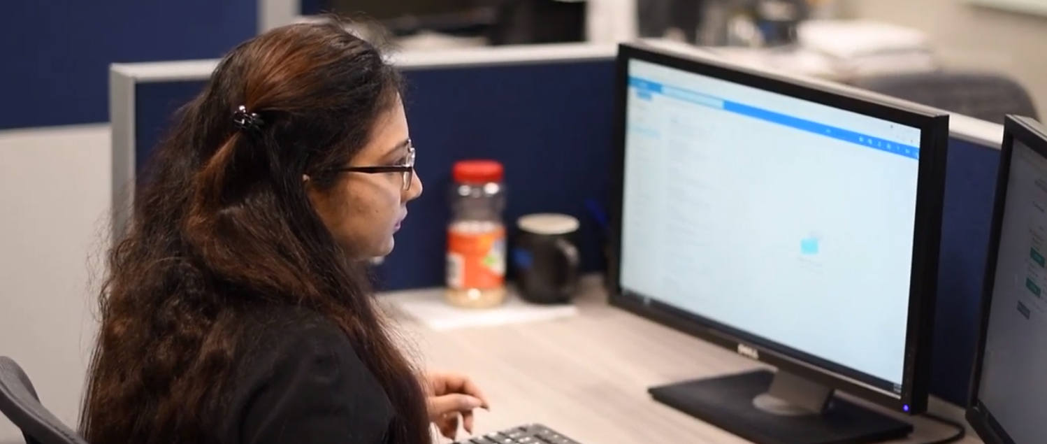 student looks at computer screens