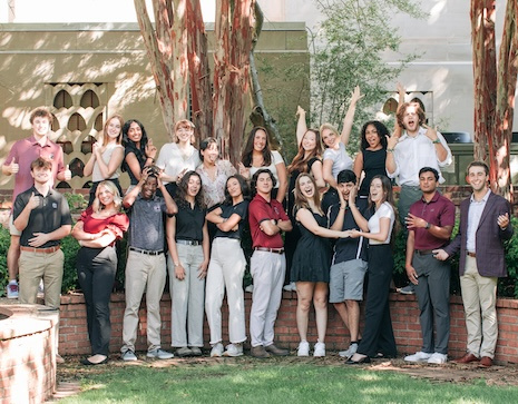 Group of 22 students posing on the USC horseshoe in silly poses