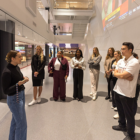 Students listen to a tour guide at MLB Headquarters in New York City