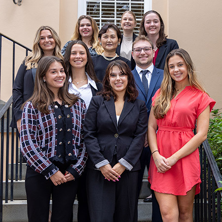 Members of Eta Sigma Delta pose for a photo after their induction ceremony at the McCutchen House.