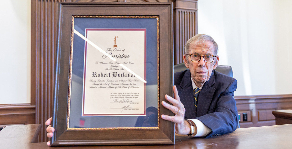 Bob Bockman holding award