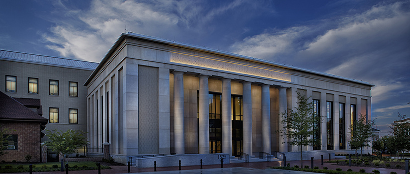 Exterior of the School of Law building at dusk