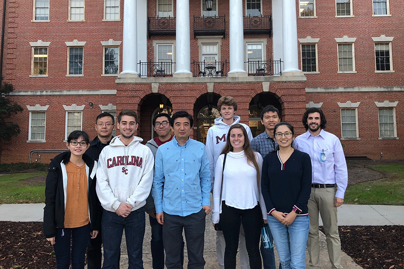 Group of Tan lab in front of Building Three