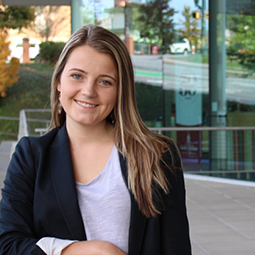 Portrait of Riley Branham in the Moore School courtyard