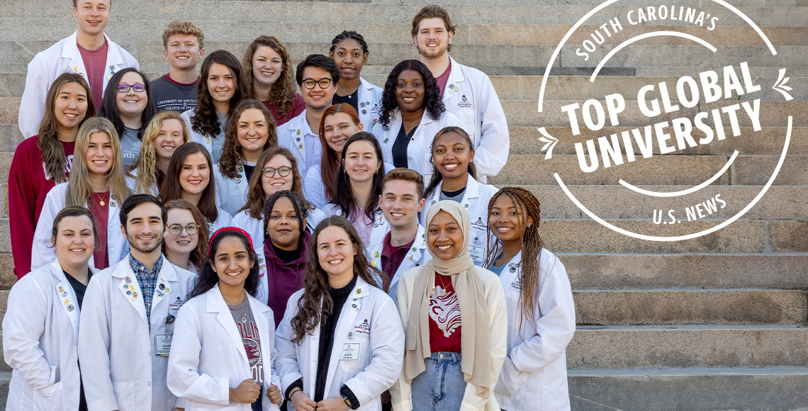 Group of pharmacy students standing on steps