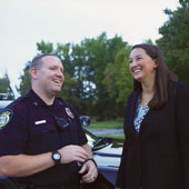 a police office and a law student talk together