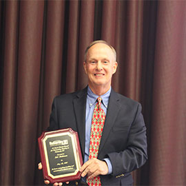 Bob Holdeman with the M. Stuart Hunter Award