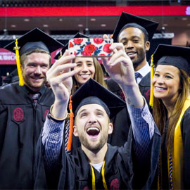 students celebrating commencement