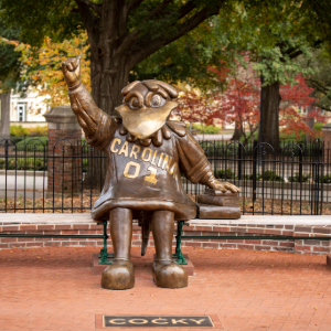 Cocky statue with bench on the USC campus.